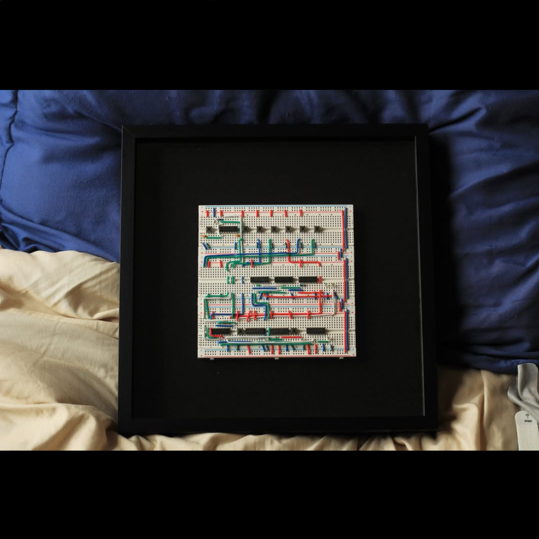 Framed hand-wired 4-bit inspired breadboard circuit art
